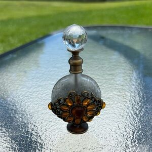 Orange flower bejeweled perfume bottle